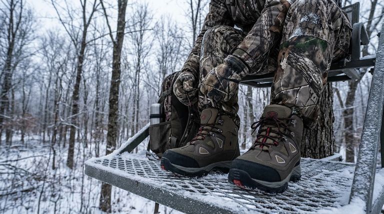 What unconventional methods help keep feet warm during cold weather hunting? Master Moisture and Circulation