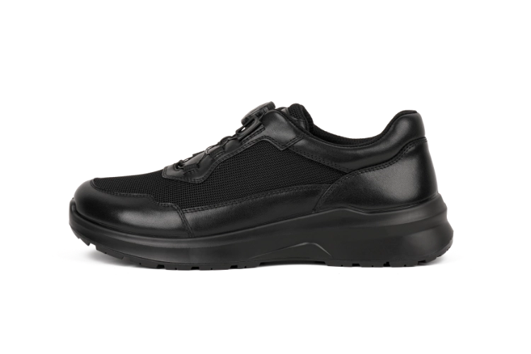 Side view of modern business shoe highlighting dial closure system